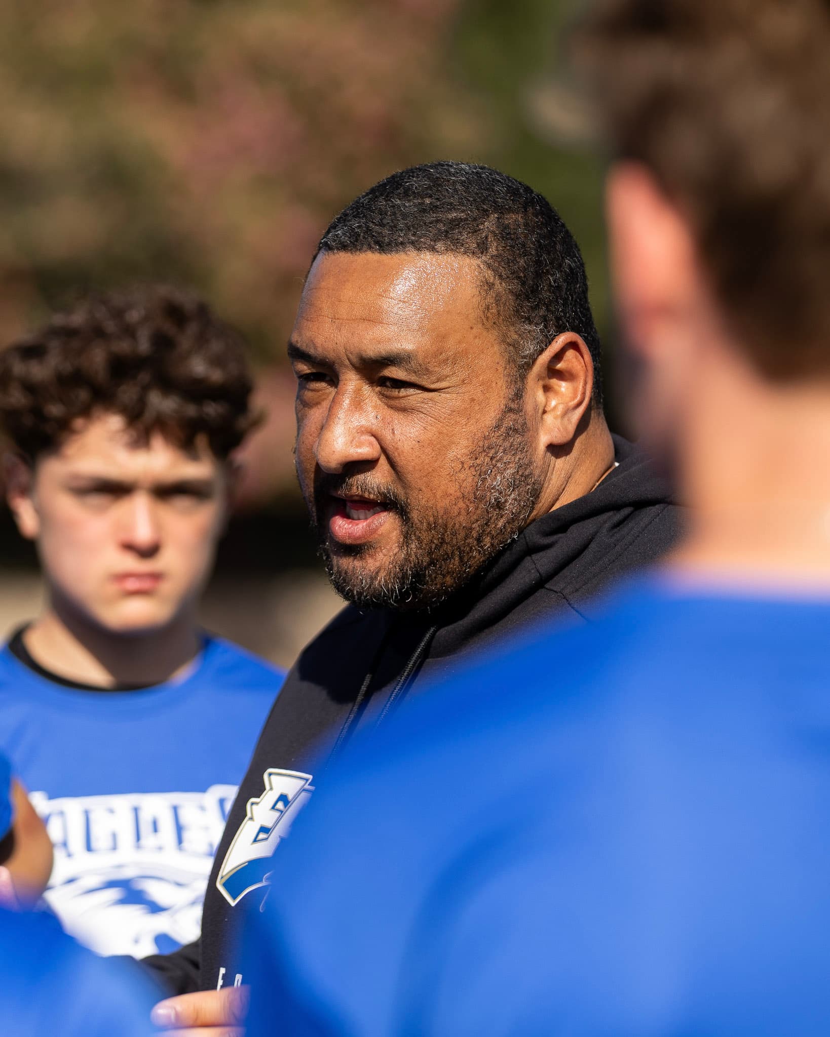 Coach speaking to the team